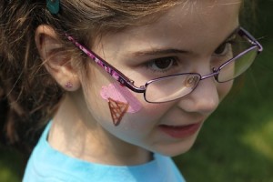 Carolyn's painted cheek - strawberry ice cream with a cherry on top!